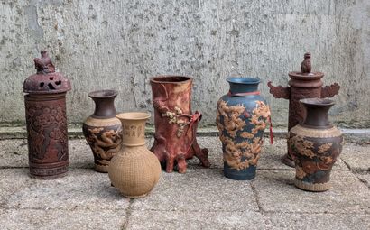 Seven unglazed terra cotta pieces: vases,...