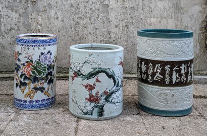 Three porcelain scroll vases, the largest...