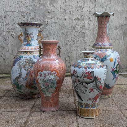 Set of four porcelain vases of various shapes,...