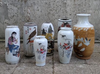 Set of seven porcelain vases with polychrome...