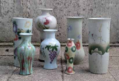 Set of eight porcelain vases of various shapes,...