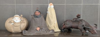 Set of four figures and animals, in polychrome...