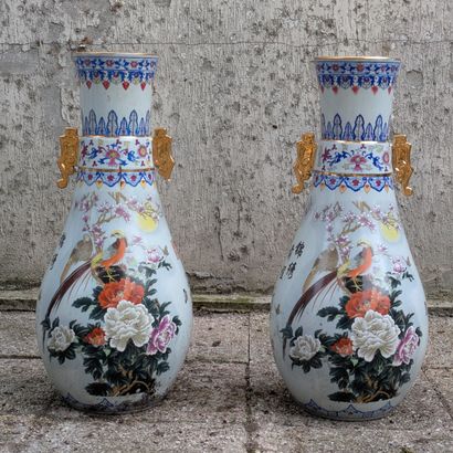 Pair of porcelain piriform vases, with polychrome...