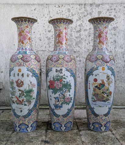 Suite of three large porcelain baluster vases...