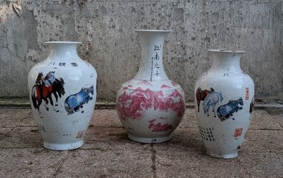 Two porcelain baluster vases decorated in...