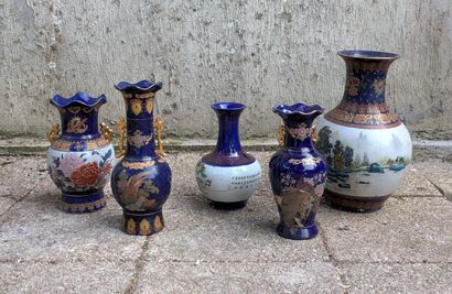 Five porcelain vases, three with corolla...
