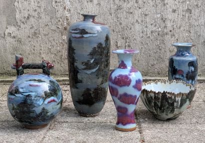 Four porcelain vases decorated with landscapes...
