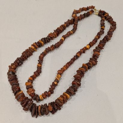 *Two amber bead necklaces. Weight: 94.43...