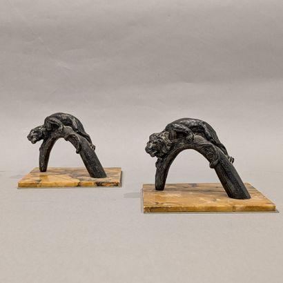 A pair of silver-plated bookends featuring...