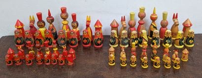 *Two suites of chess pieces in painted wood....