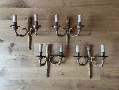 Suite of four bronze sconces, the quiver-shaped...
