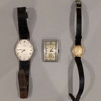 *OMEGA. Two metal watches, the first rectangular...
