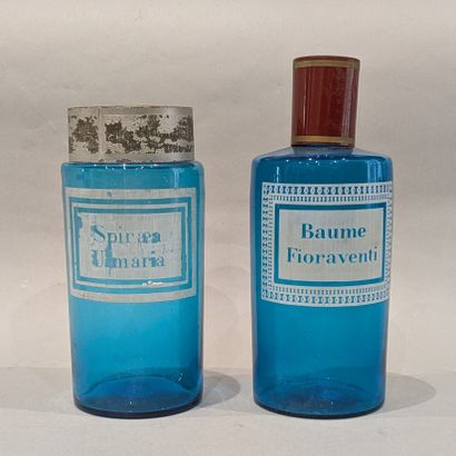 Two blue-tinted glass medicine jars, one...