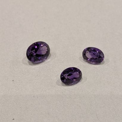 *Set of three oval amethysts.