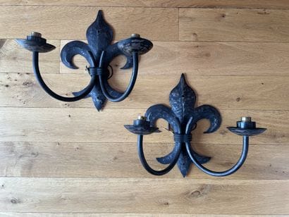 Pair of wrought-iron sconces, the two arms...