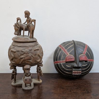 *Carved wooden covered pot, the lid surmounted...