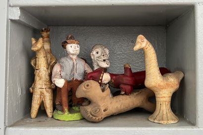*A set of painted terracotta figurines as...