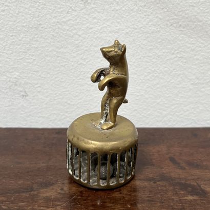 *Bronze rattle featuring a cat on a cage...