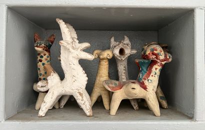 *A set of painted terracotta figurines as...