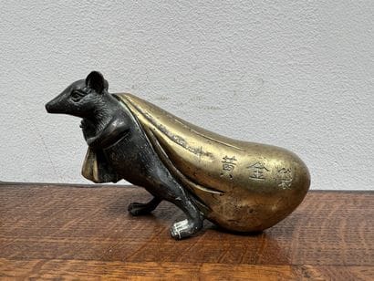 *Vietnamese work. Statuette of a rat pulling...