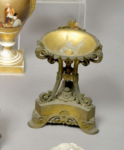 Large ormolu tripod base decorated with palmettes...