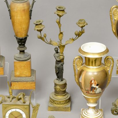 Patinated and gilded bronze torch depicting...