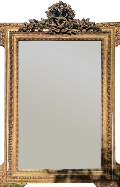 Mirror with gilded wood surround decorated...