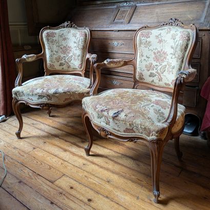 Pair of walnut armchairs, molded and carved...
