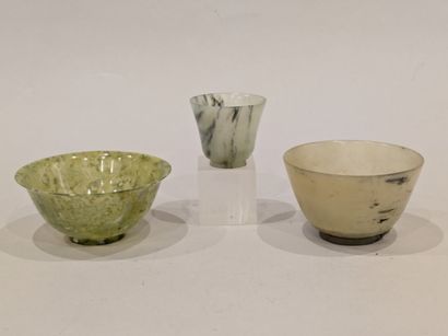 China. Set of three green hardstone bowls....
