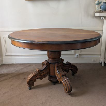 Walnut dining table, the oval top with blackened...