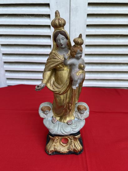 Virgin and Child in painted and gilded terra...