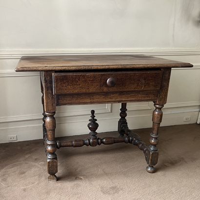 Rustic oak table, one-drawer waist. Baluster-turned...