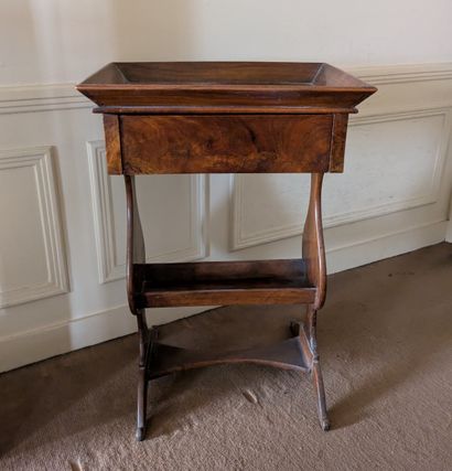 Walnut and walnut veneer work table. The...