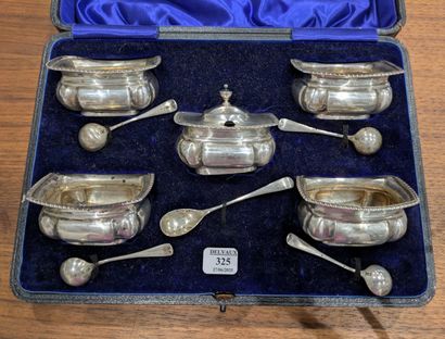 Suite of four saltshakers and their salt...