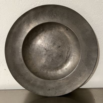 Large pewter dish, with wide wing, figured...