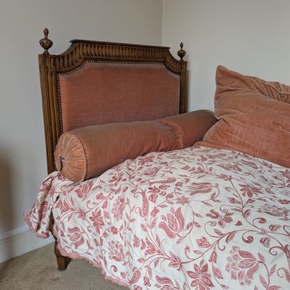 Natural wood bed carved with channels and...