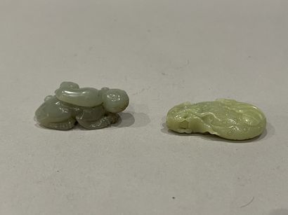 China. Two carved jadeite groups, one depicting...