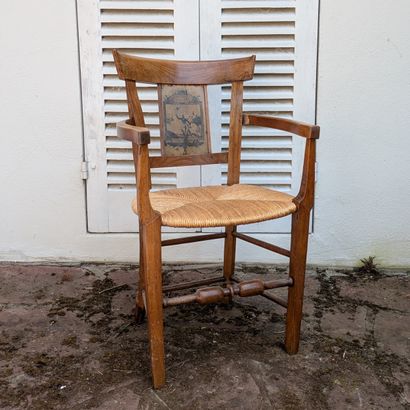 Armchair in fruitwood, the curved back, the...