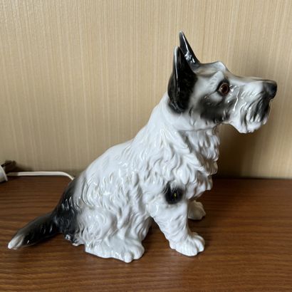 Porcelain nightlight featuring a seated Scottish...