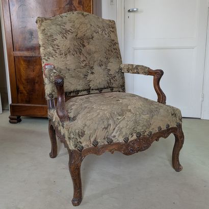 Natural wood armchair, molded and carved...