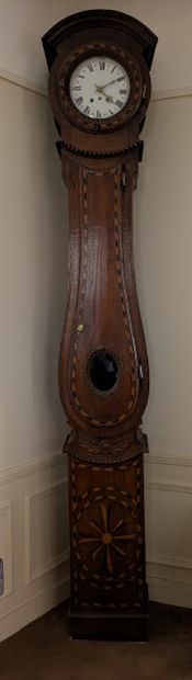 Floor clock in natural wood, carved with...