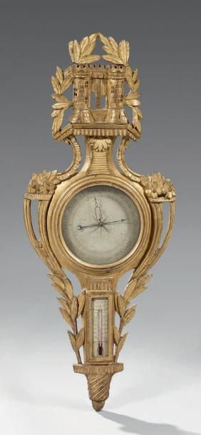 Baromètre thermomètre en bois doré, la partie...