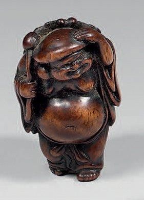 Netsuke en buis à patine brune, Daikoku debout...
