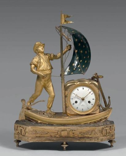 Pendule en bronze doré représentant un jeune...