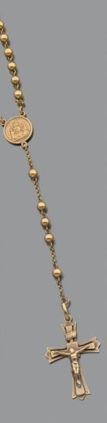 Chapelet en or jaune (750) et croix crucix.
Poids...