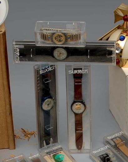 SWATCH

Lot de quatre montres comprenant:...