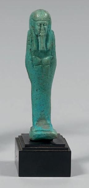 Oushebti anépigraphe en faïence bleue.
Egypte....