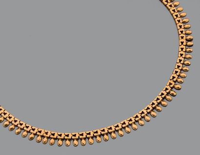 Collier ruban à palmettes en or jaune 18K...
