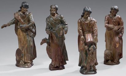 Suite de quatre statues en bois sculpté anciennement...