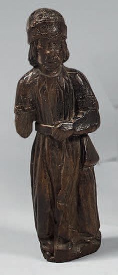 Statuette d'un personnage masculin en bois...